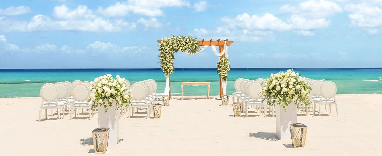 Beachfront Palace Resorts destination wedding ceremony with elegant tropical décor, luxury all-inclusive wedding venues in Mexico and Jamaica